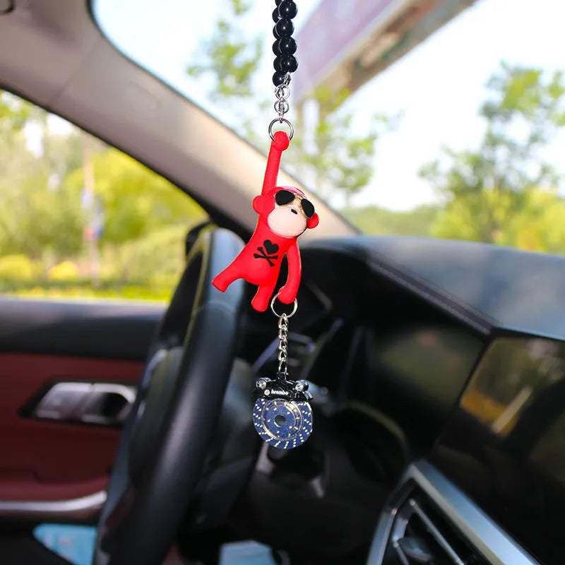 Cartoon monkey wearing sunglasses rearview mirror pendant on a bead necklace.