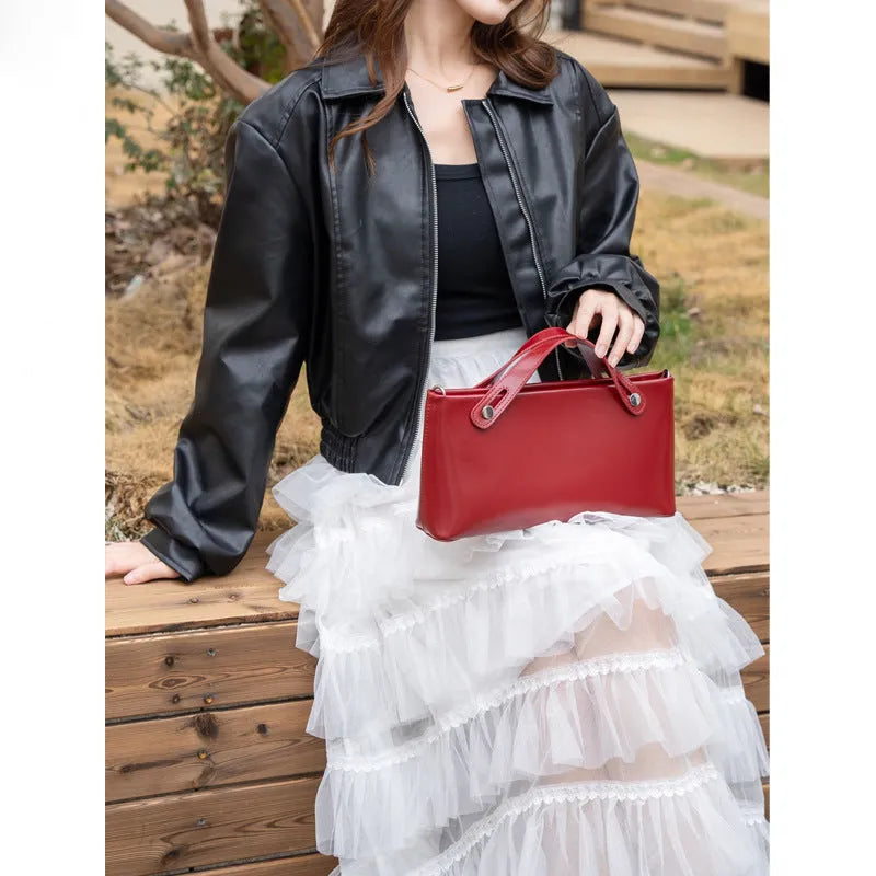 Genuine leather messenger shoulder bag in Wine Red, horizontal square shape, visible sewing thread detailing