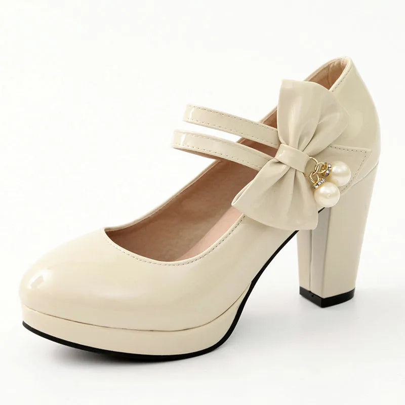Red women's chunky heel platform shoes with a round toe and buckle fastening on a rubber sole.