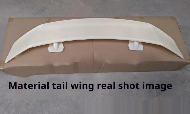 A universal punch-free ABS plastic car tail wing spoiler showing bright black, white, and carbon pattern finish options.