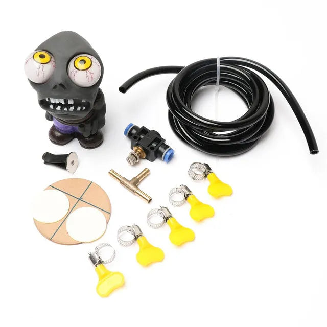 Turbo car blow-off valve kit with rubber doll ornament, pressure regulator, copper tube, and mounting clips.