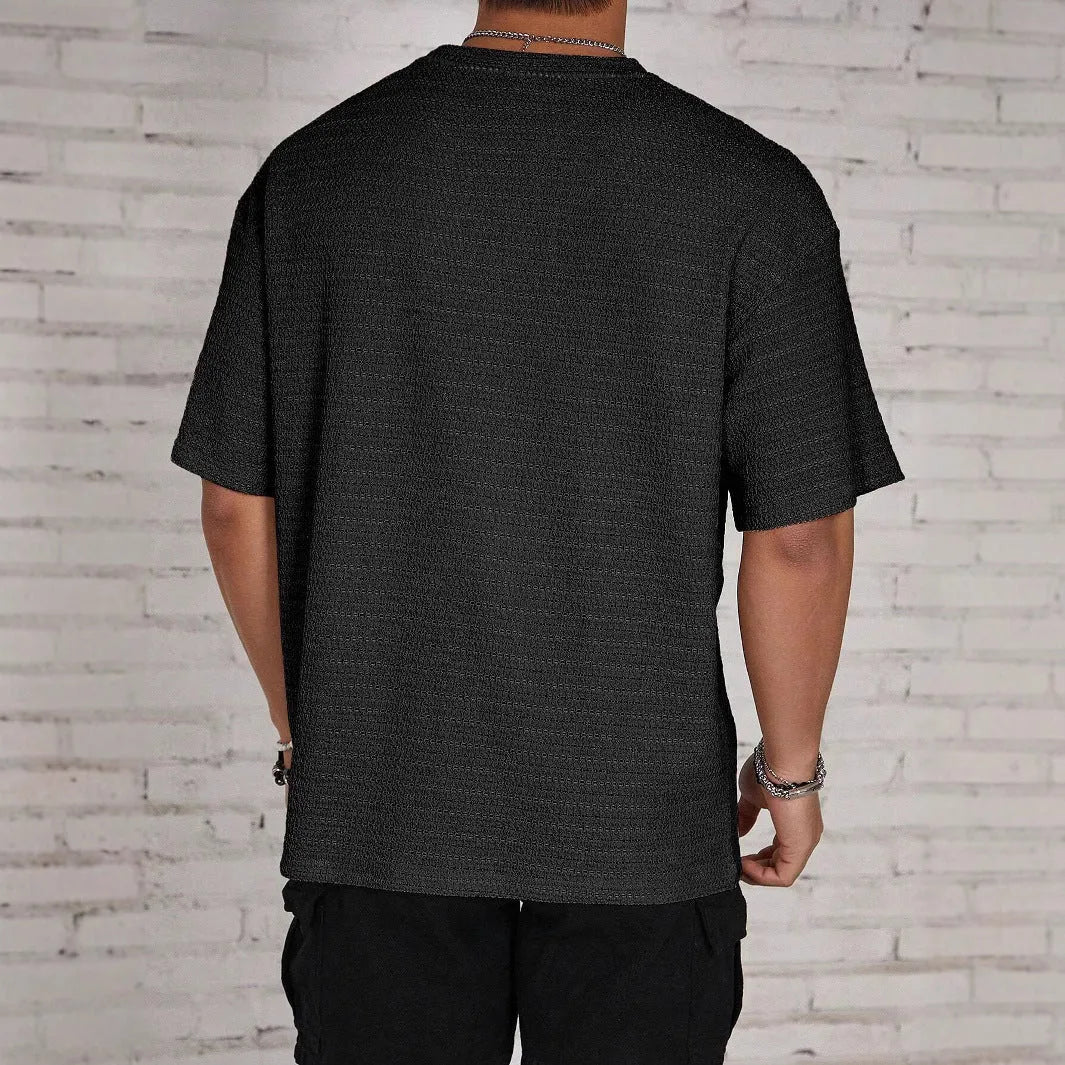 Men's slim fit loose hollow T-shirt in solid colour on a hanger
