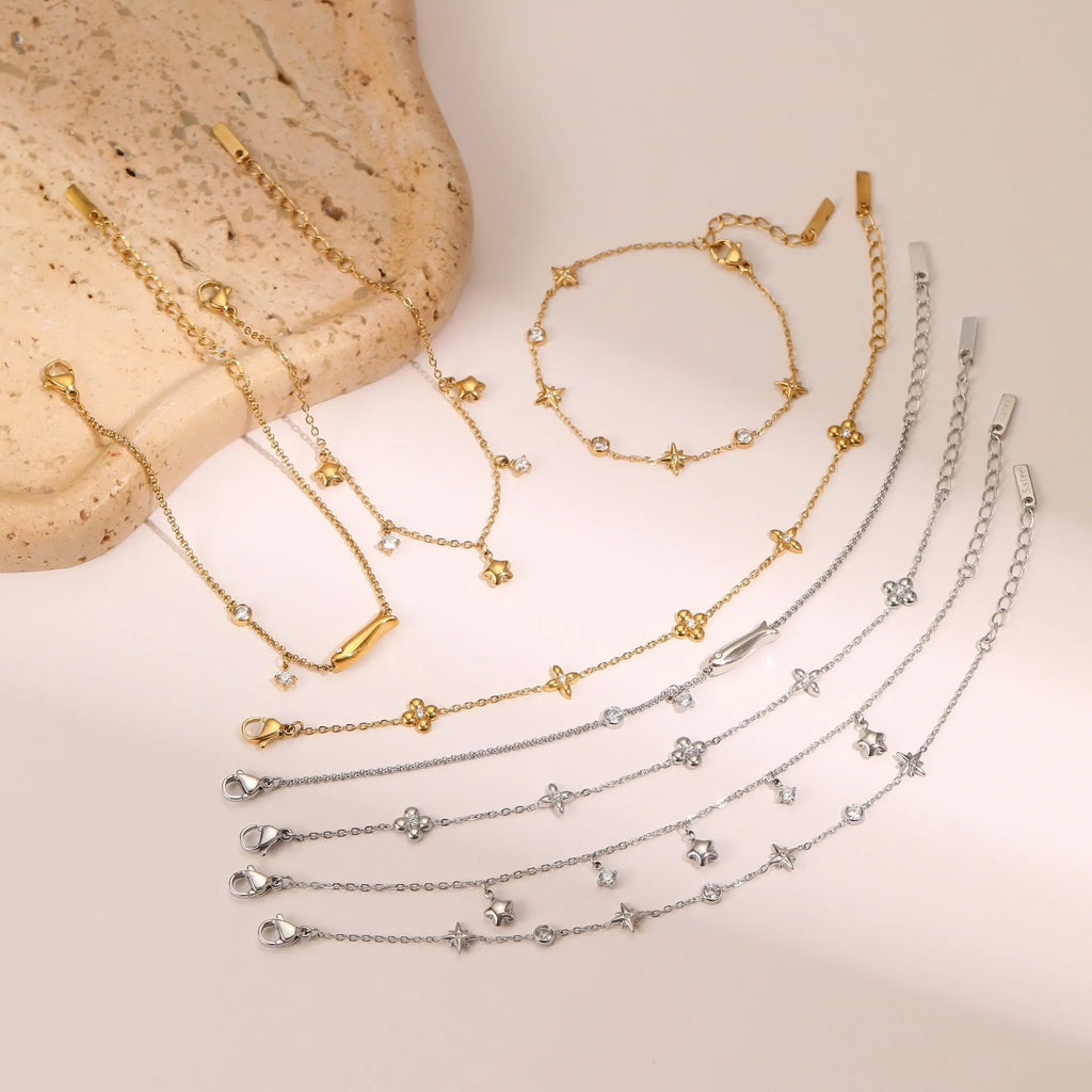 Women's stainless steel bracelet with 18K gold plating and a hexagonal zircon star pendant.