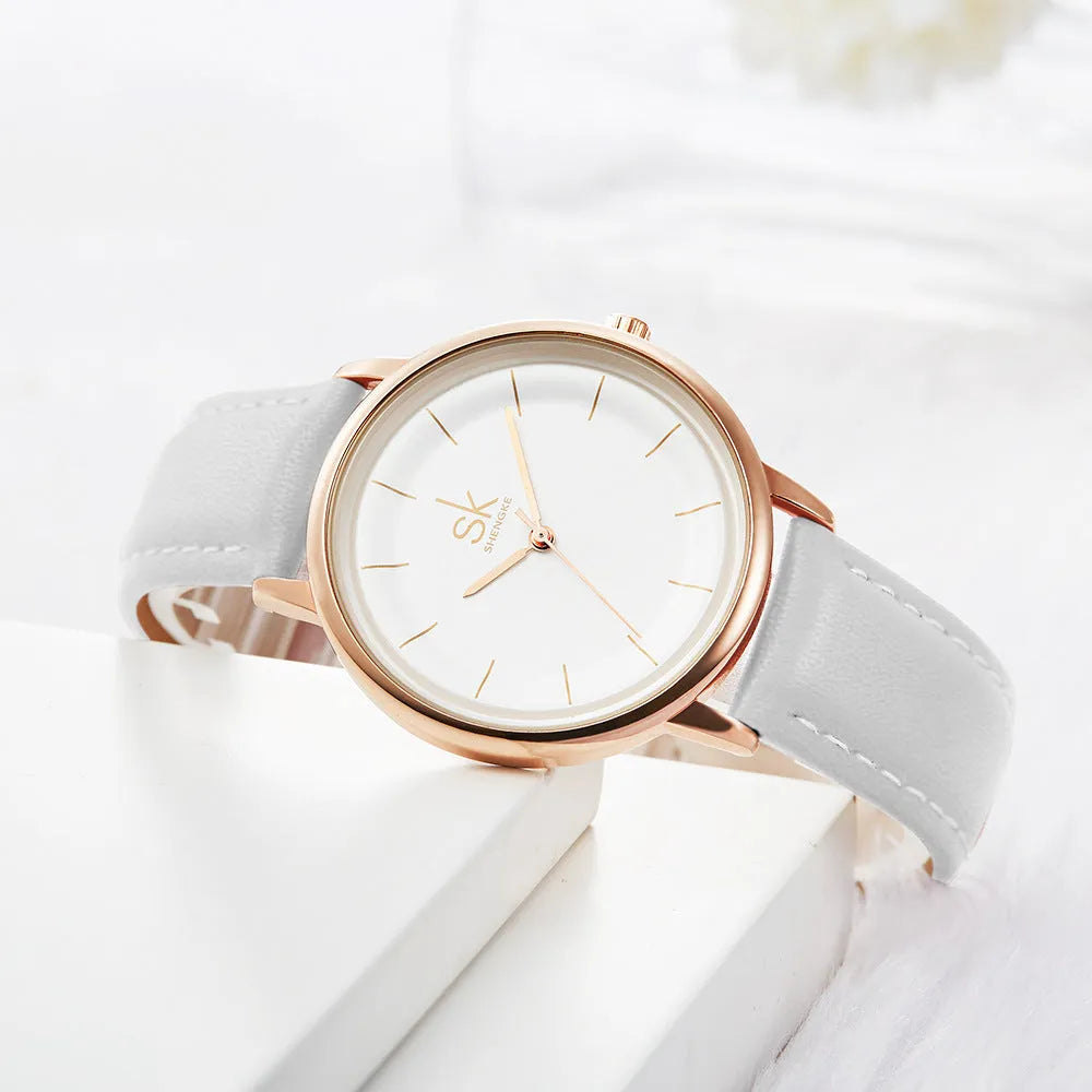 Rose gold alloy case women's quartz watch with white PU strap and round 38mm dial
