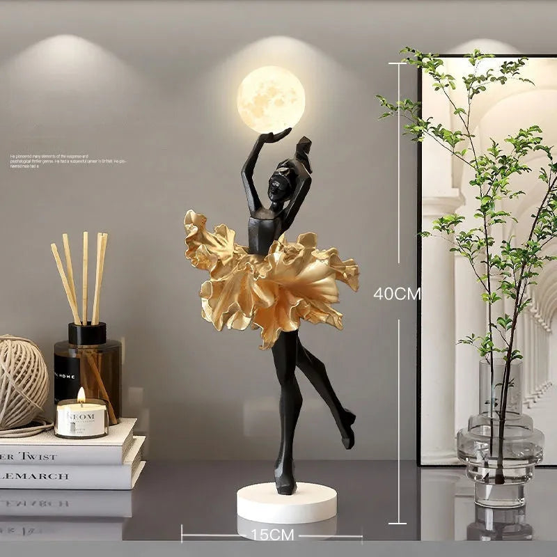 Small modern night lamp ornament in resin showing colour options: black gold, white, pink, and light blue.