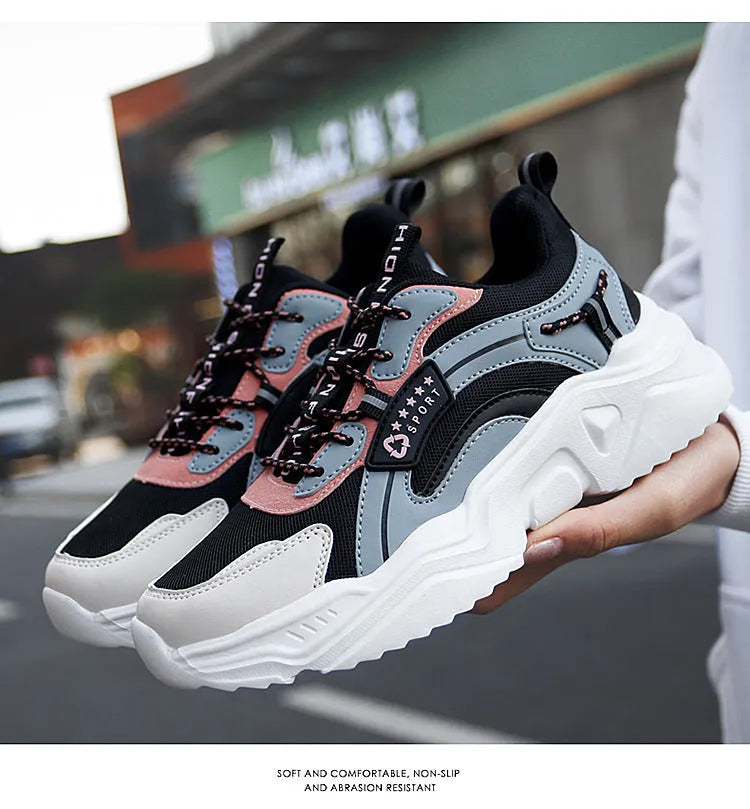 White women's casual sports shoes with mesh upper, thick PU sole, round toe, and a buckle strap.