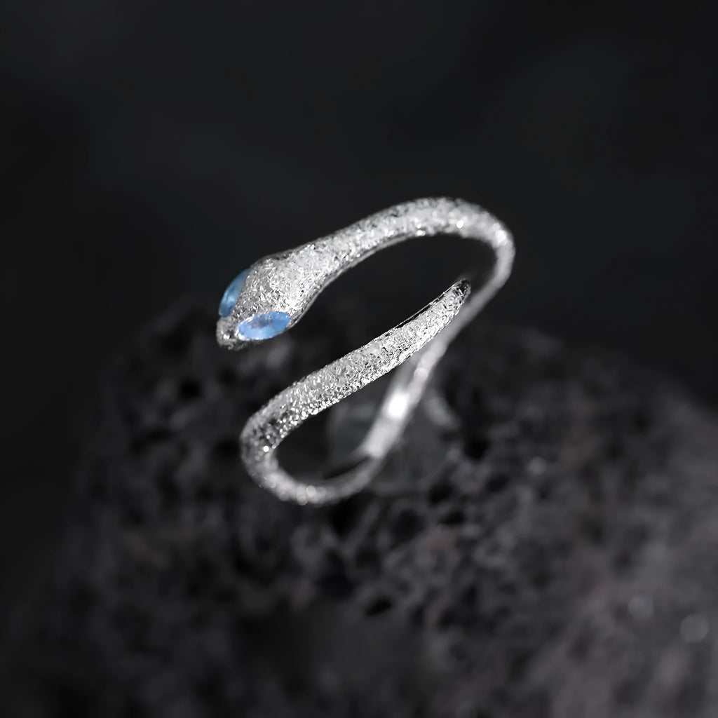 Women's adjustable silver snake zodiac ring in platinum colour.
