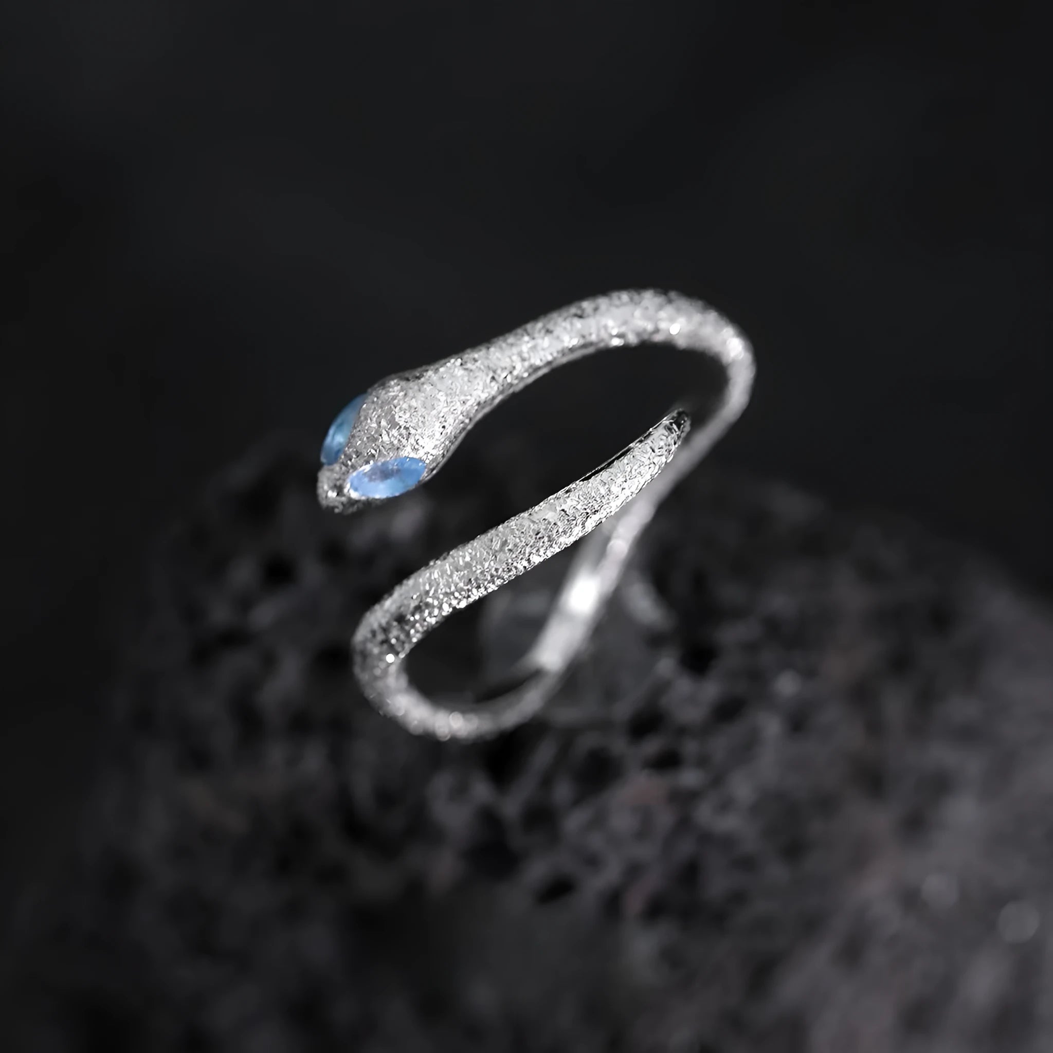 Women's adjustable silver snake zodiac ring in platinum colour.