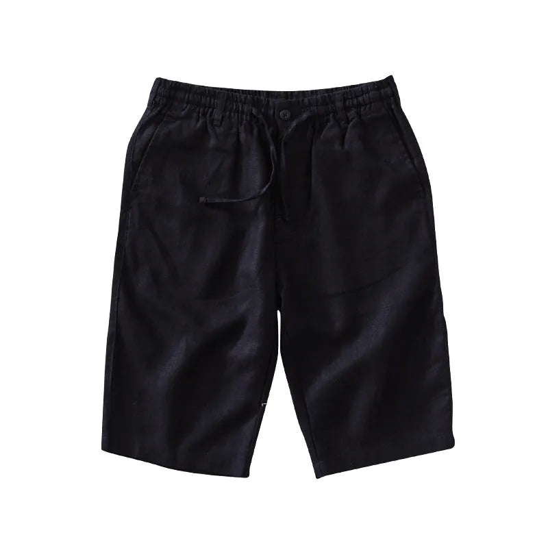 Men's loose-fitting linen capri pants in a light colour, showing the straight-leg style.