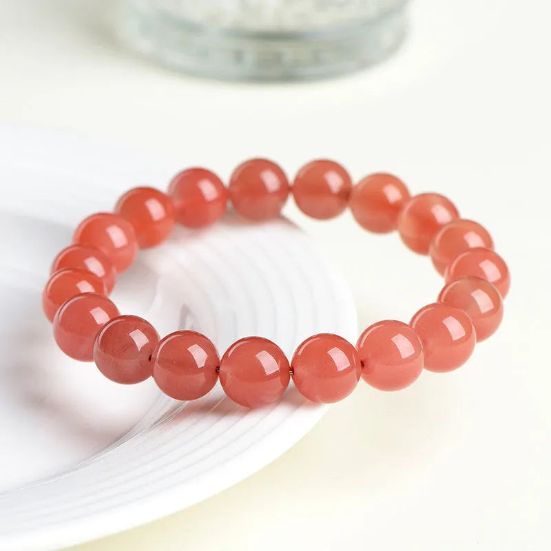 Natural cherry red agate scattered bead bracelet with polished stones, shown in various size options.