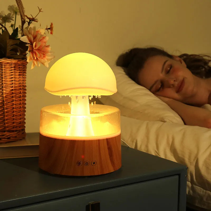 White cloud-shaped humidifier with falling raindrops and colour-changing night light