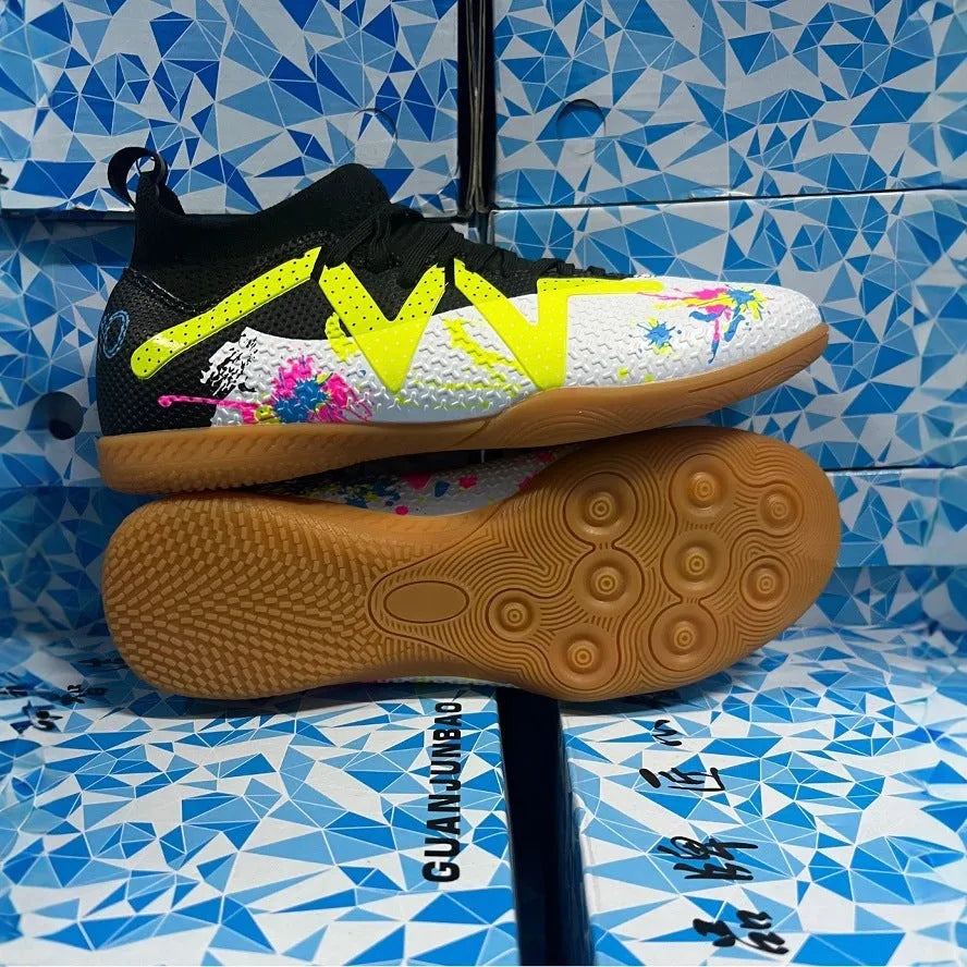 Black and yellow low-top football boots with removable studs on a non-slip rubber sole.