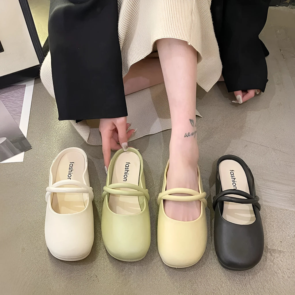 Women's plastic baotou flip flop sandals in green, shown from the side.
