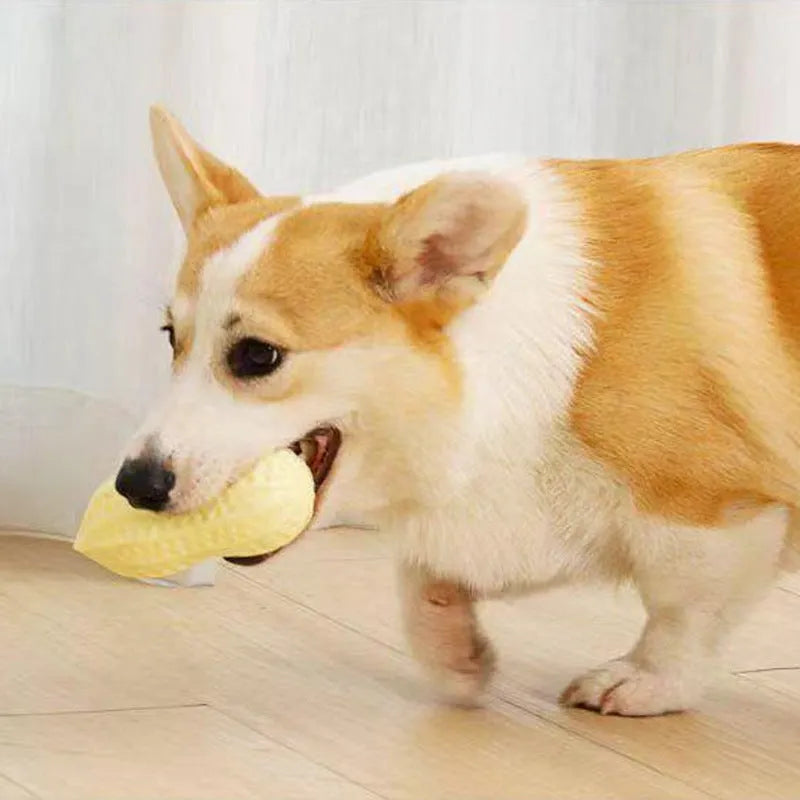 Yellow TPR peanut-shaped dog chew toy with textured surface for teeth cleaning.