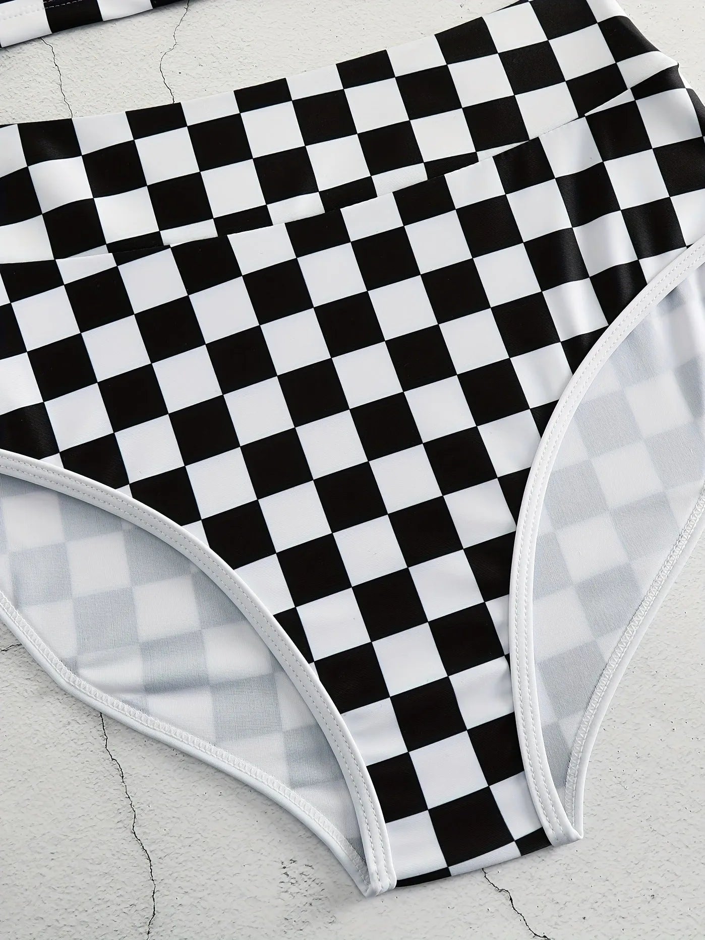 Women's checkerboard pattern racing one-piece swimsuit with backless design and suspender straps