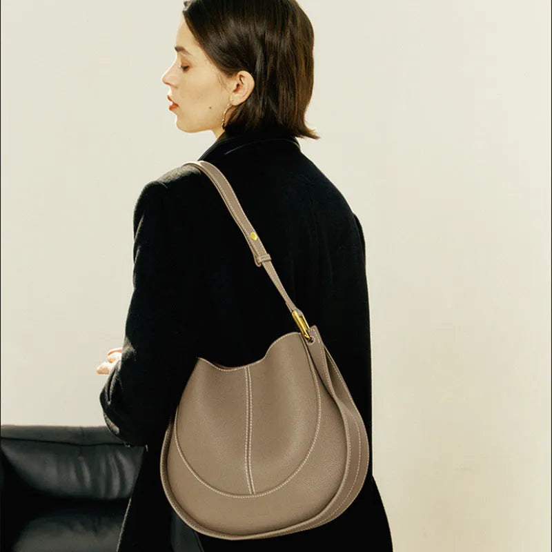 Designer small crossbody bag for women, genuine leather, round shape, retro splicing, milkshake white colour