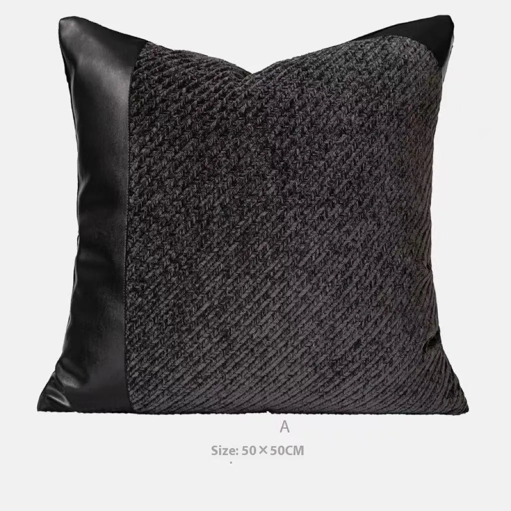Modern minimalist grey and white plaid bed runner blanket set with a leather round pillow on a bed.