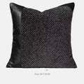 Modern minimalist grey and white plaid bed runner blanket set with a leather round pillow on a bed.