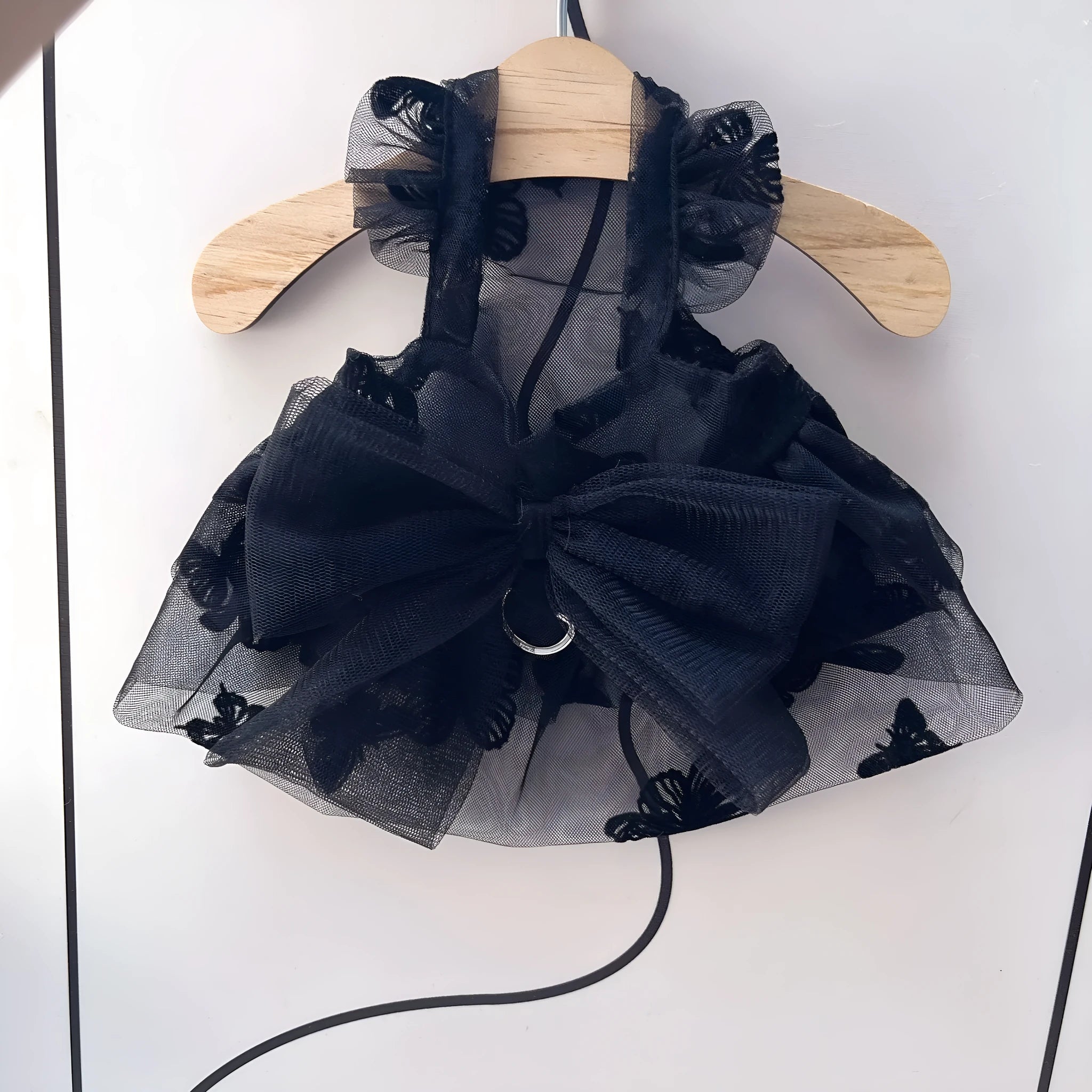 Black tulle princess skirt costume for a small dog on a mannequin.