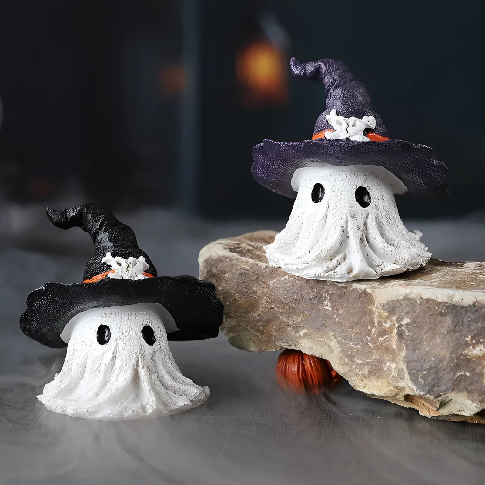 A detailed resin wizard hat ornament in either black or purple, for Halloween and holiday decoration.
