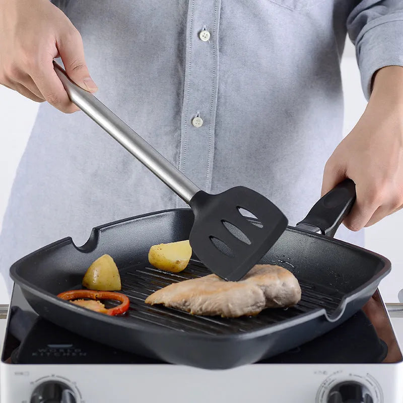 Black silicone spatula set with stainless steel handles containing 16 kitchen utensils