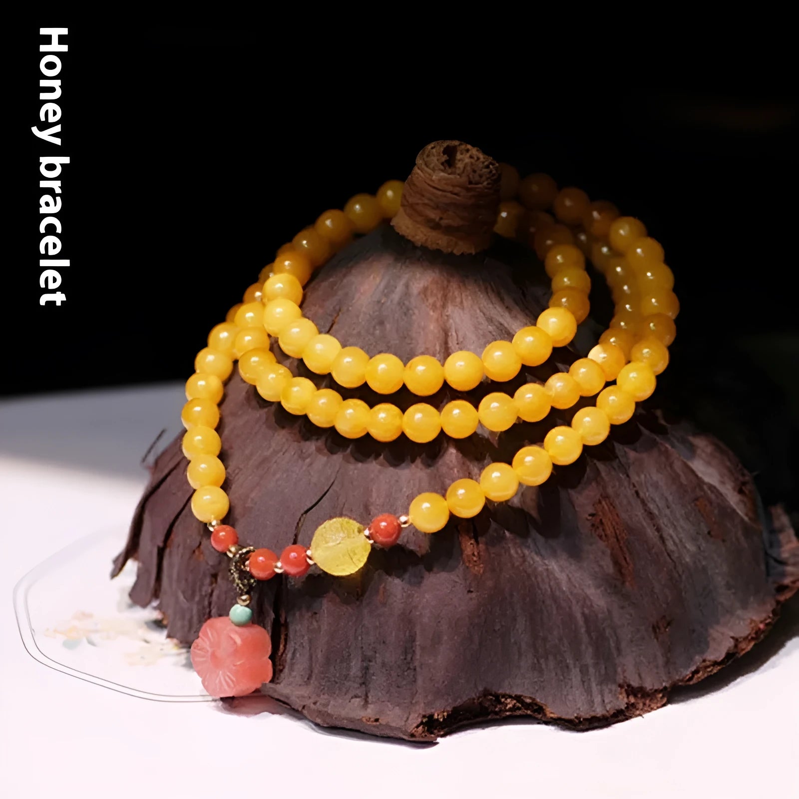 Women's retro-style amber bracelet with animal zodiac modelling in yellow chicken grease colour, 5mm round beads.