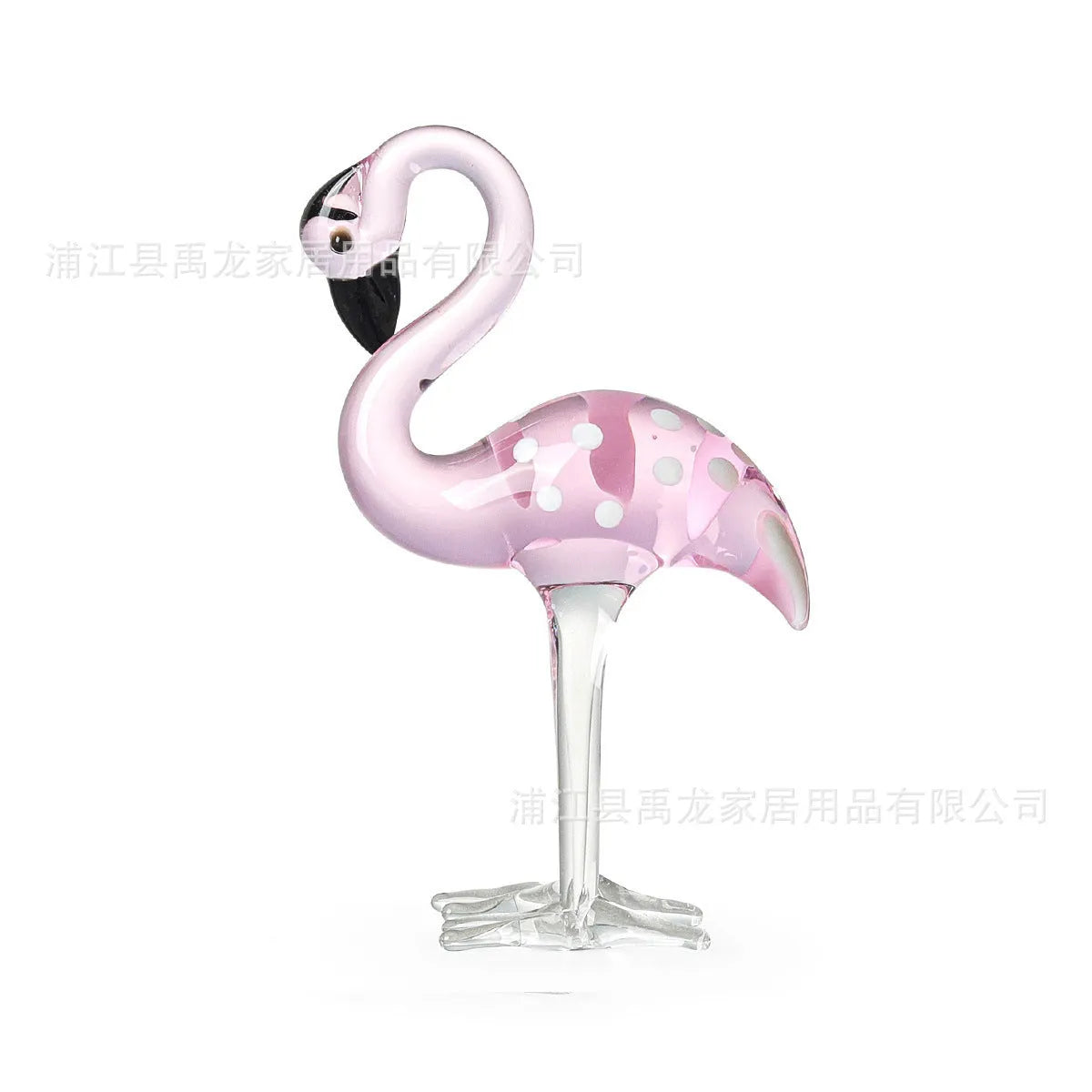 Pink crystal simulation flamingo decorative ornament on a table for home decor or gifting.