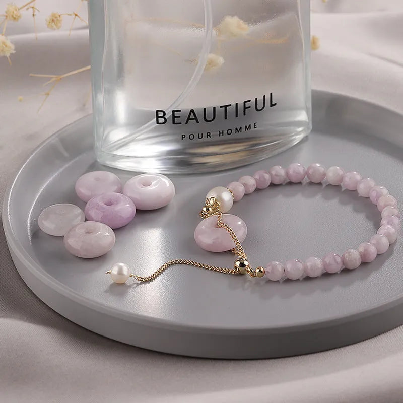 Women's Korean style crystal bracelet showing options with jade pendant or coloured stone safety buckle.