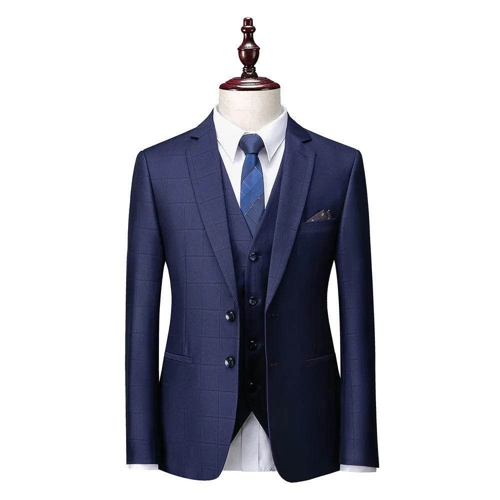 Men's slim fit plaid three-piece suit in navy blue with jacket, vest, and trousers
