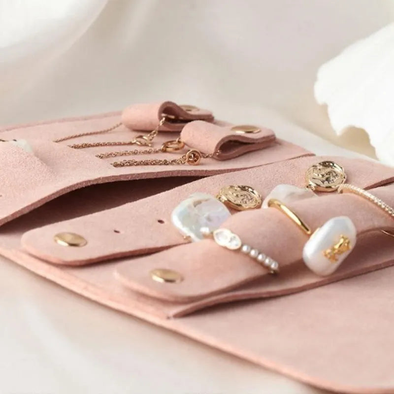 Soft brown leather jewellery storage pouch for earrings and rings, shown at 12cm square size.