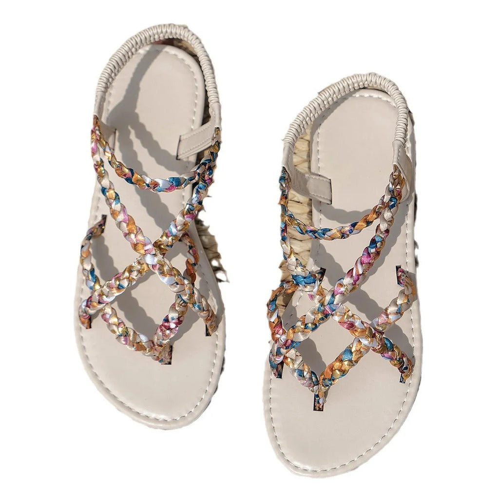 White and black flat sandals with cloth upper and elastic band fastening
