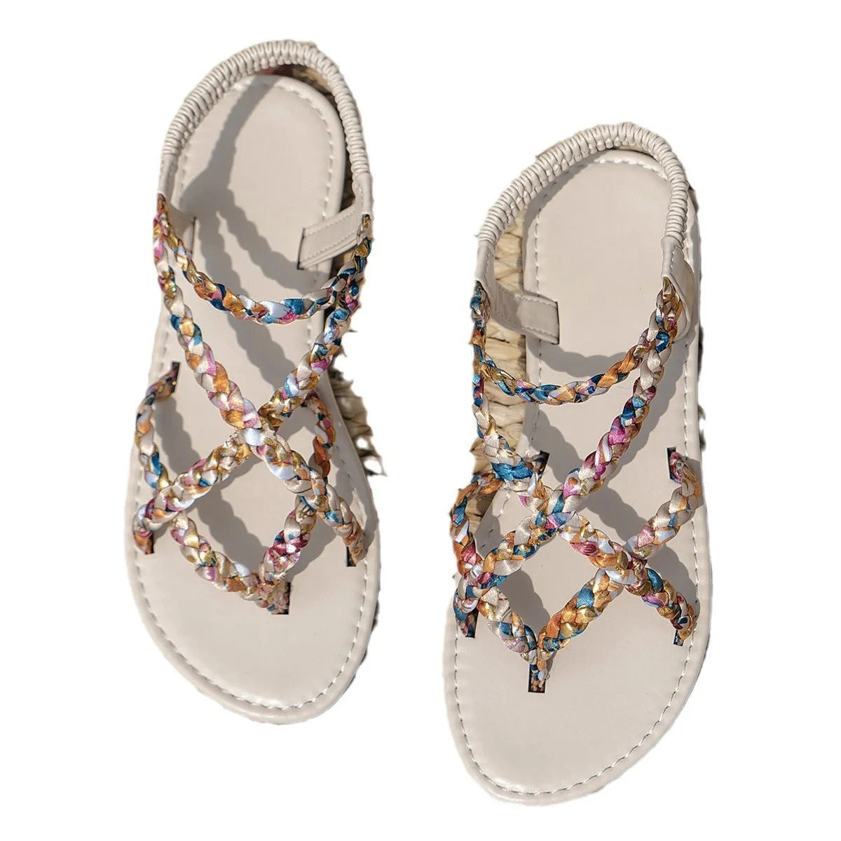 White and black flat sandals with cloth upper and elastic band fastening