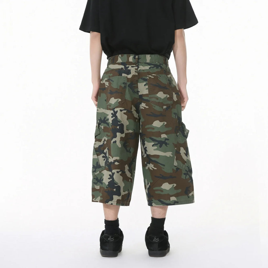Men's camouflage pattern cotton trousers with wide leg design and cropped length showing side stitching detail