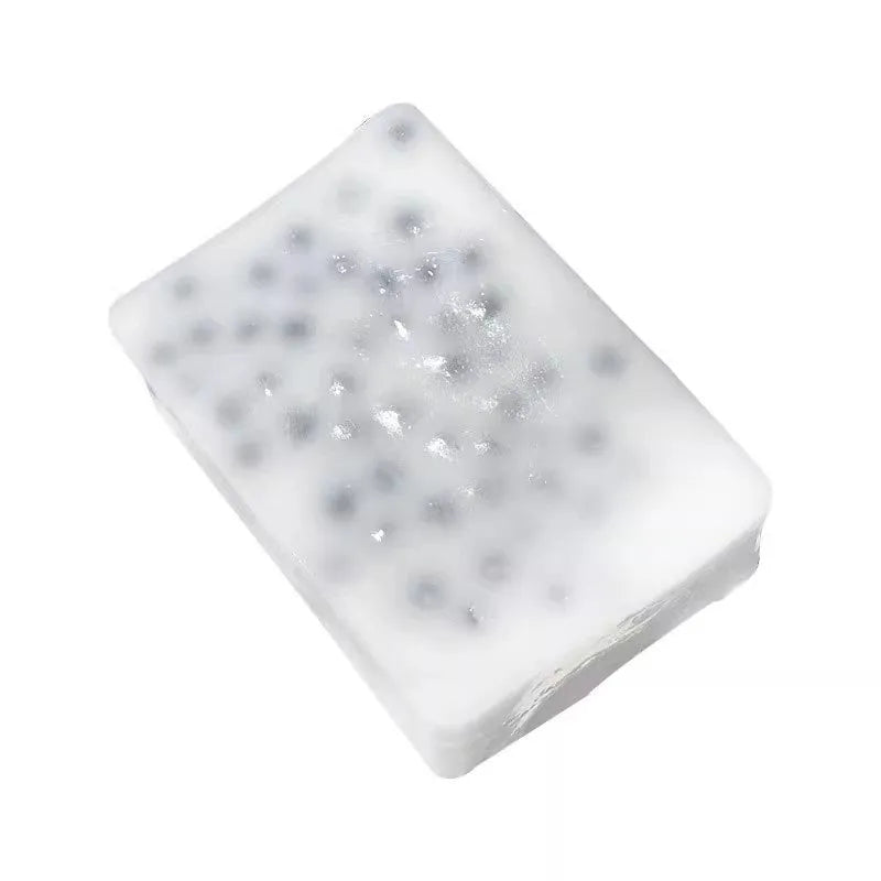Black TPR decompression toy shaped like a tofu block on a plain background