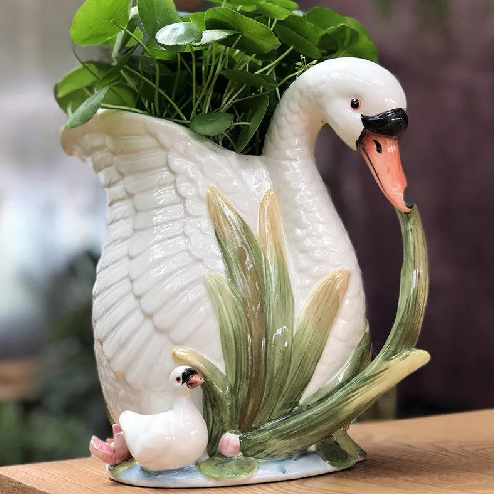 Ceramic vase with embossed swan pattern, pastoral style, 24.1cm length, picture colour, on a shelf