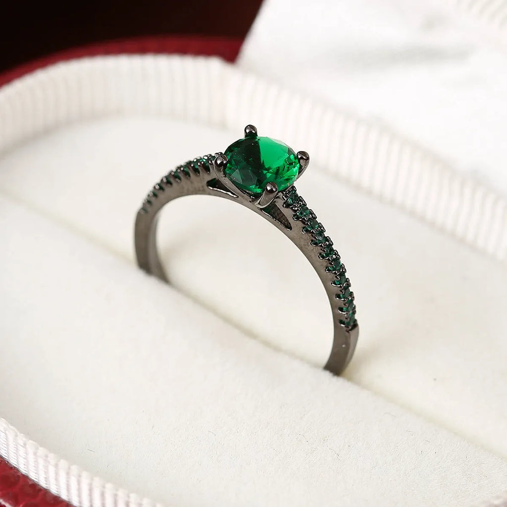 A hexagonal zircon fashion ring made from copper, shown in an electroplated gold rose red finish.
