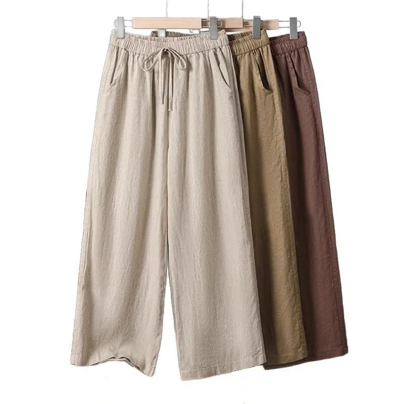 Women's apricot-coloured straight-leg casual trousers with an elastic waistband and white lace-up drawstring detail.
