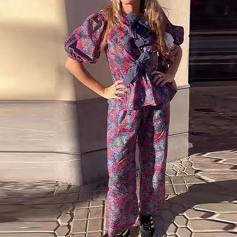 Women's floral print trouser suit set with puff sleeve blouse and matching trousers