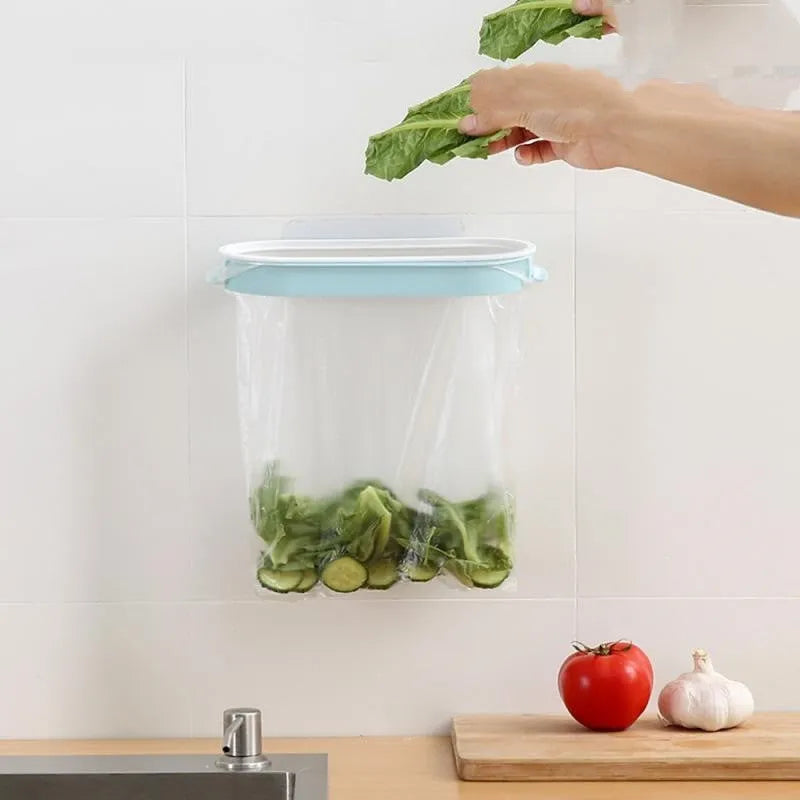 Blue or pink plastic kitchen garbage bag storage rack for mounting on cabinet or wall