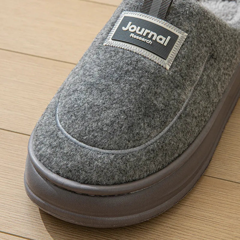 Men's grey suede slippers with thickened bottom and EVA sole showing extended sizing label