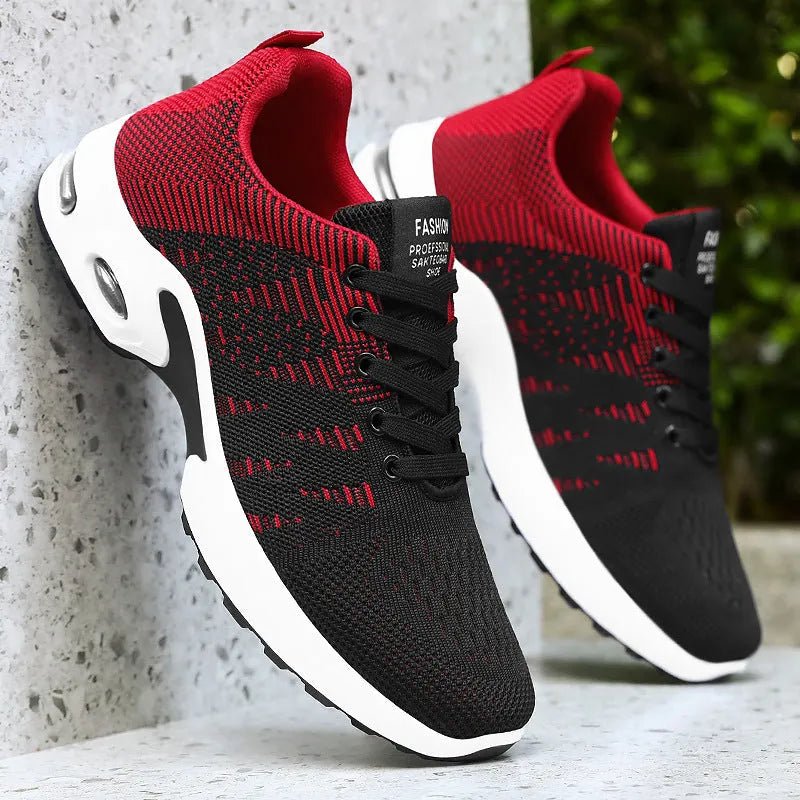 Men's black and grey Flyknit mesh low-top casual sneakers with lace-up front and soft sole.