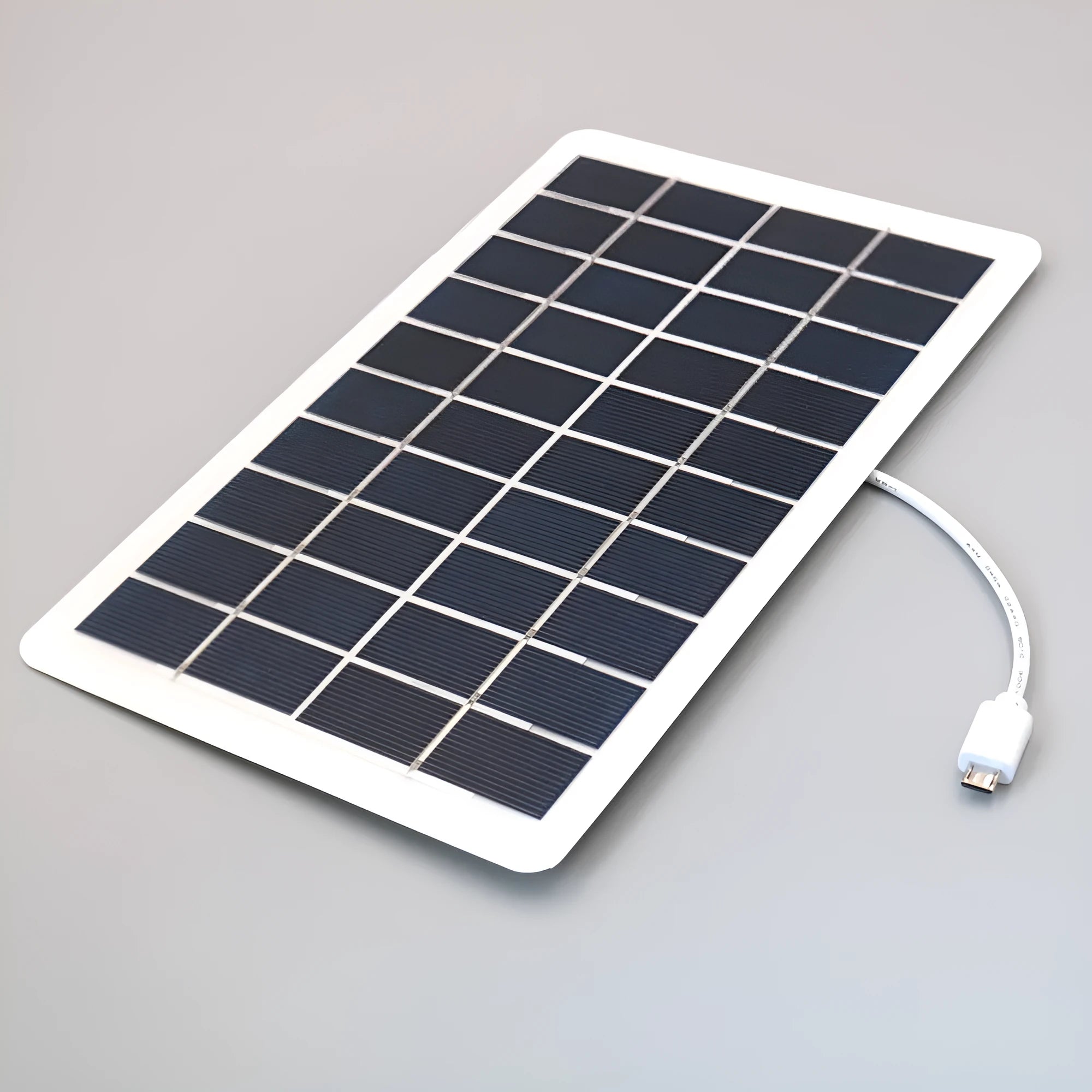 Black solar phone charging panel with USB port showing PET textured surface