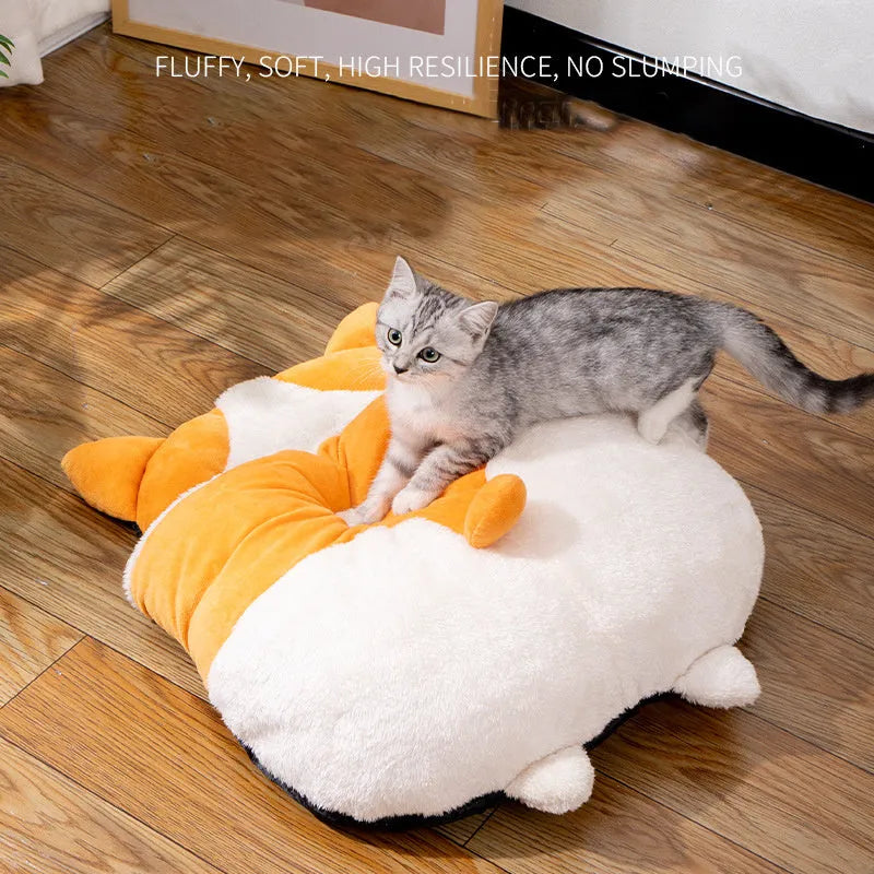Orange semi-closed cat sleeping bag bed measuring 65cm by 53cm.
