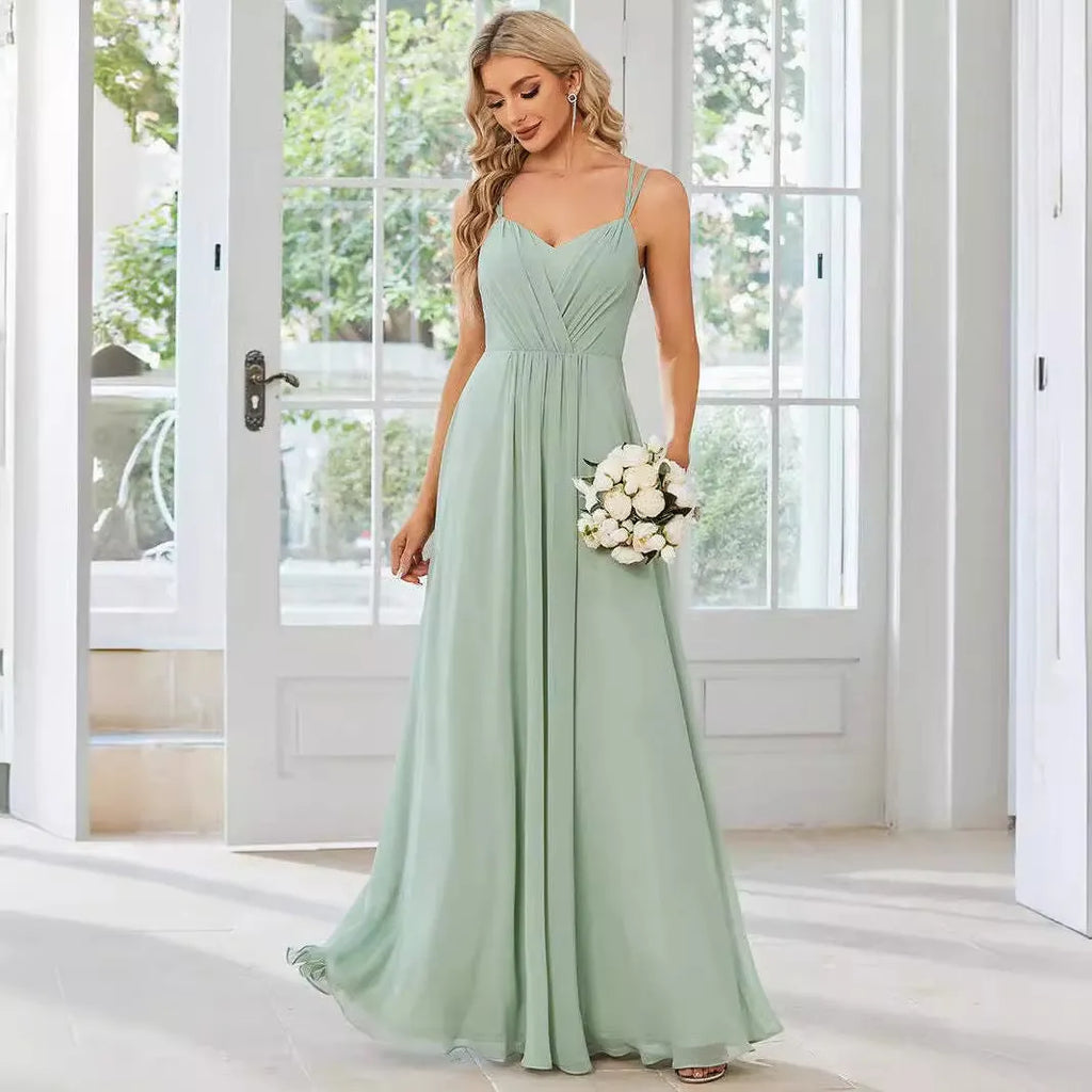 Women's sleeveless sling neck pleated dress in light green with A-line skirt for banquet events