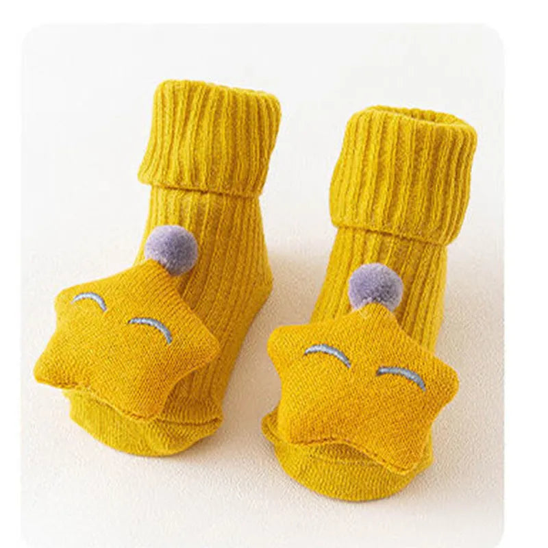 Cotton baby socks with non-slip soles in multiple designs including bows, stars, and animal prints.