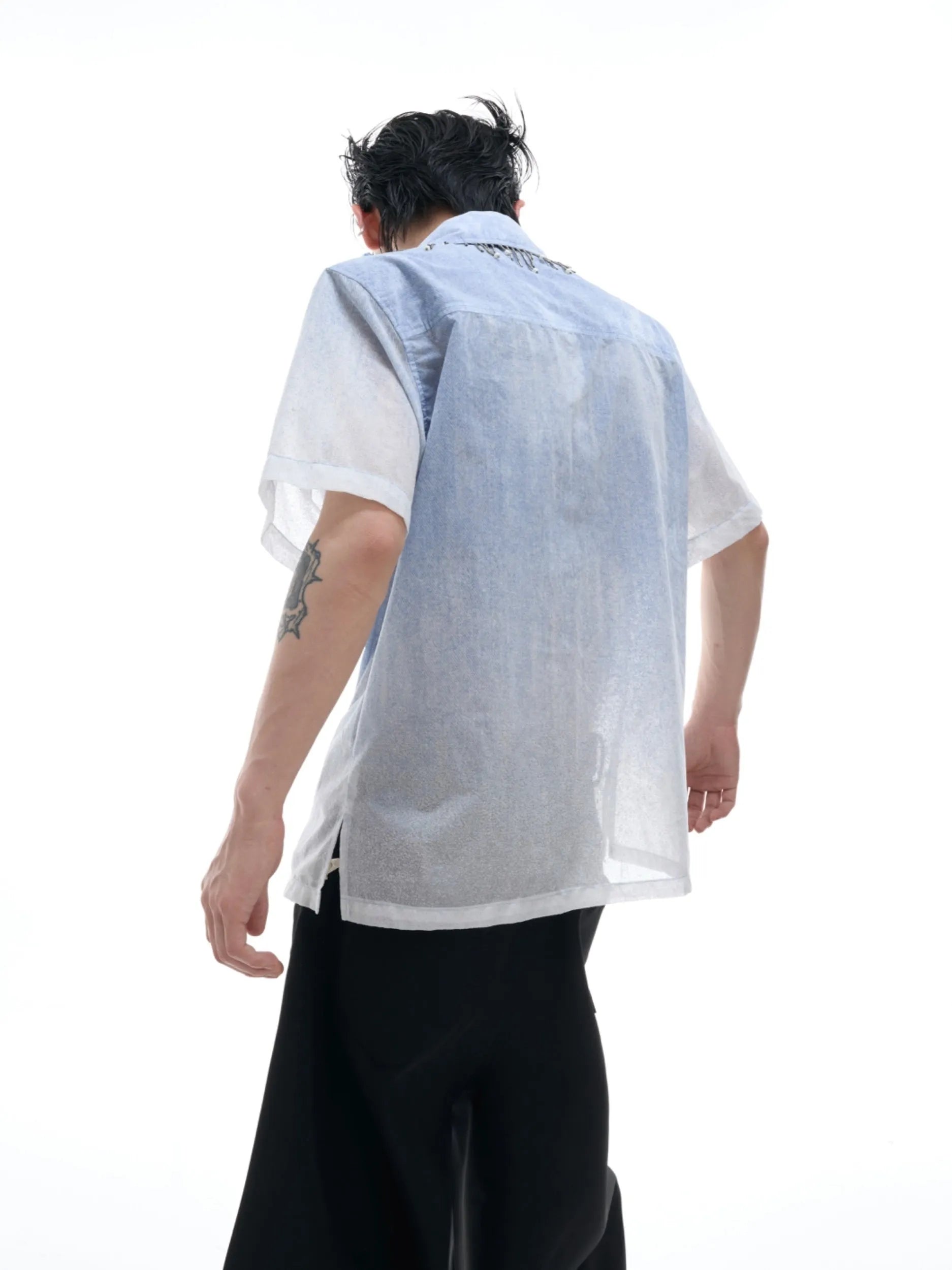 Men's blue and white gradient loose-fit short sleeve summer shirt on a hanger.
