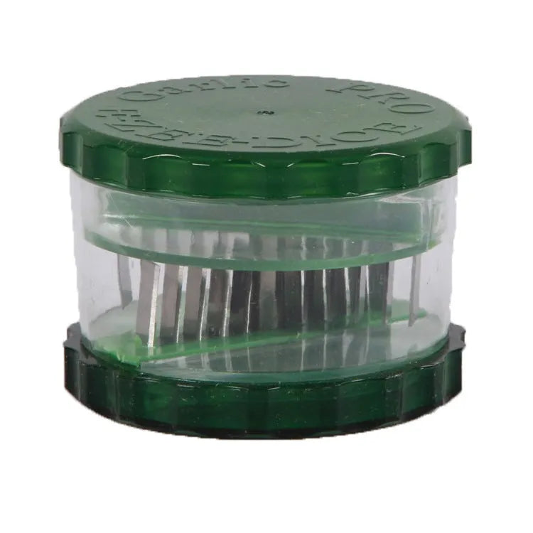 Green transparent silicone garlic peeler tube on a kitchen counter
