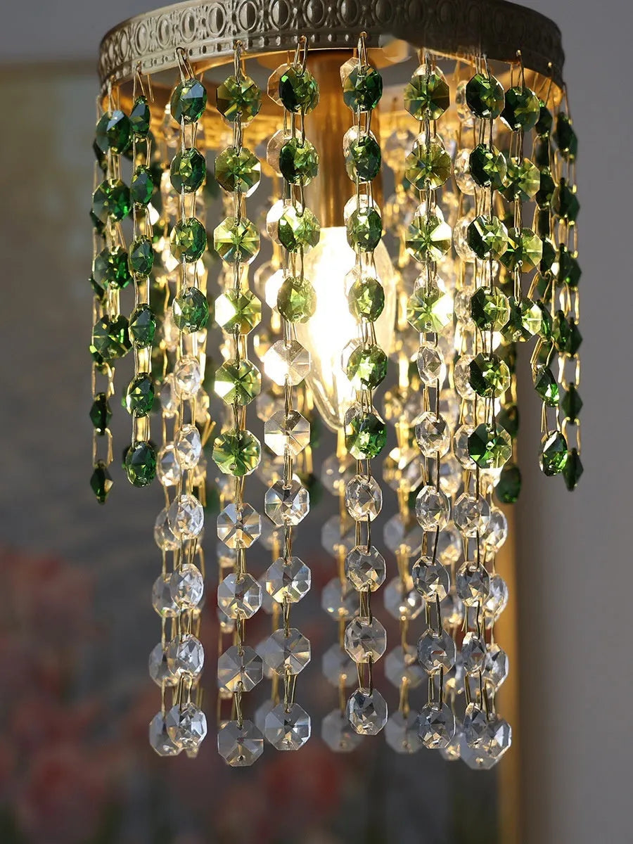 Retro green glacier bedside crystal small droplight with light luxury style on a wooden surface