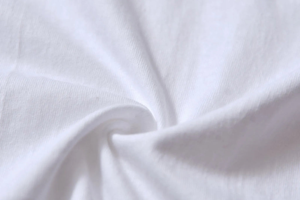 White cotton denim overalls with round neck and short sleeves, loose fit pullover style
