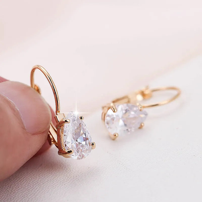 Women's drop-shaped copper earrings with gemstone inlay in gold or platinum colour options